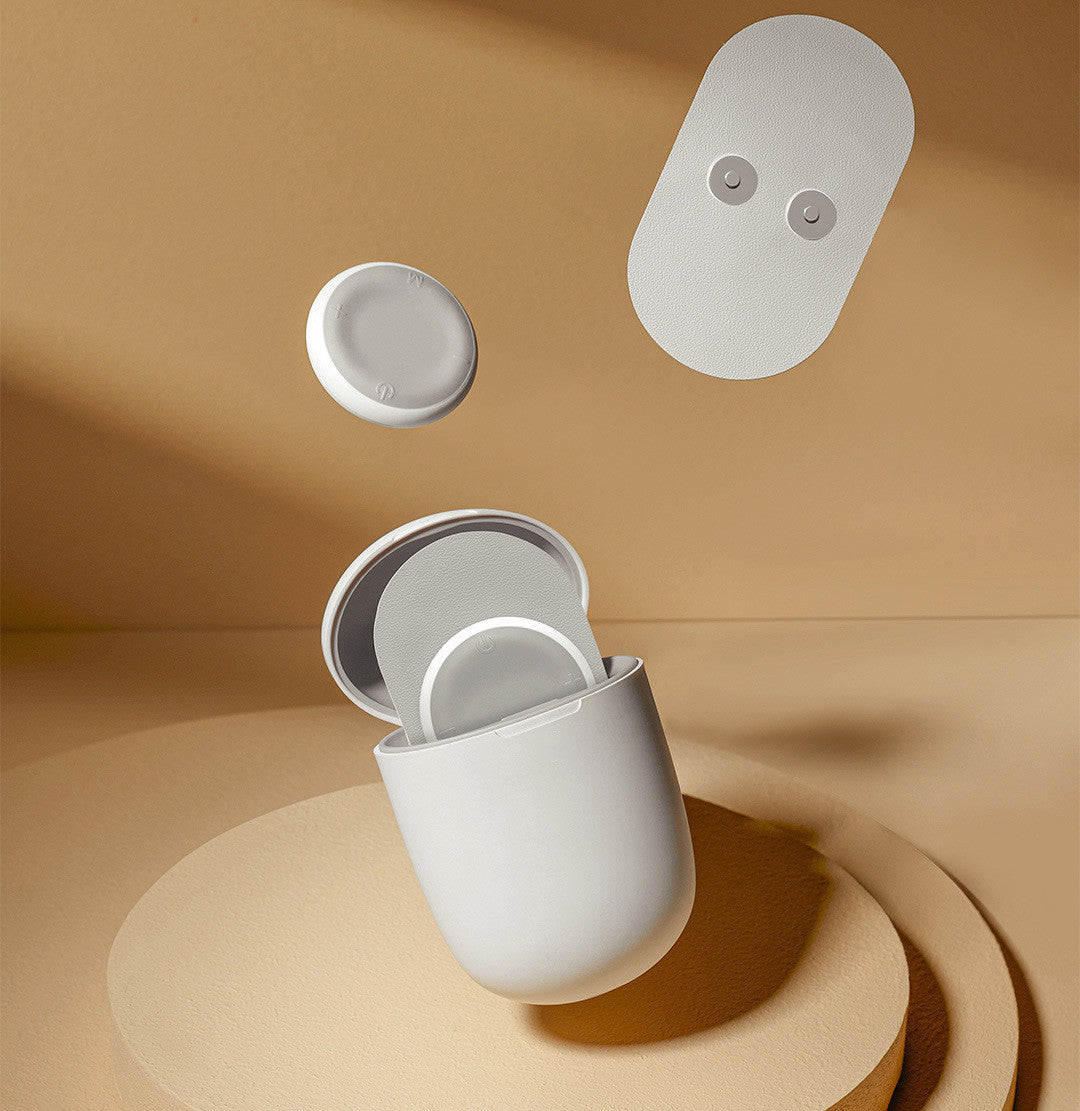 White wireless earbuds with charging case on a beige background